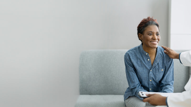 Doctor Talking With Elderly African Patient